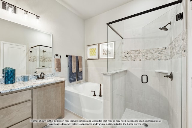 bathroom featuring separate shower and tub and vanity