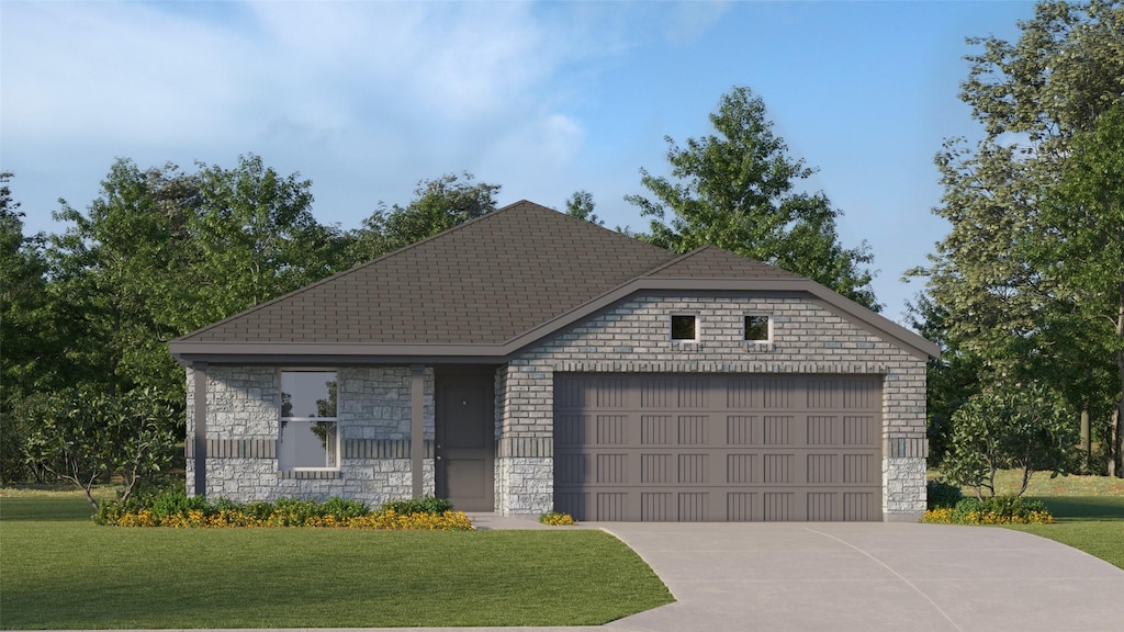 view of front of home with a front yard and a garage