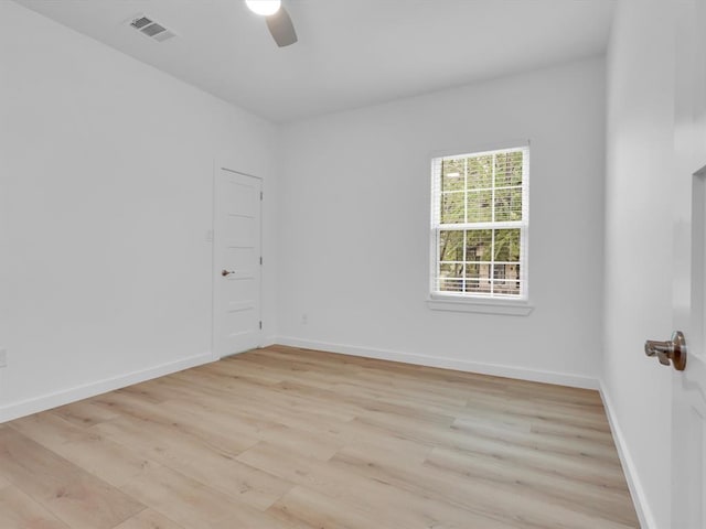 spare room featuring ceiling fan and light hardwood / wood-style floors