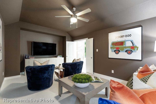 living room with ceiling fan and lofted ceiling