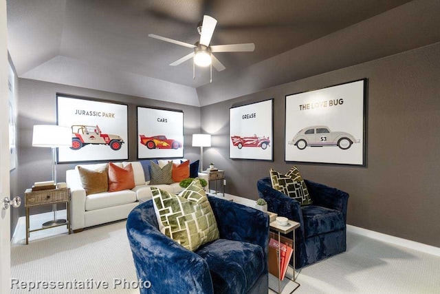 carpeted cinema room featuring ceiling fan and lofted ceiling