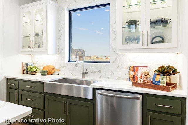 bar with green cabinets, white cabinetry, dishwasher, and sink