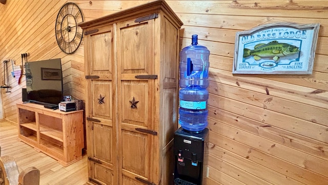 details featuring wooden walls and hardwood / wood-style floors