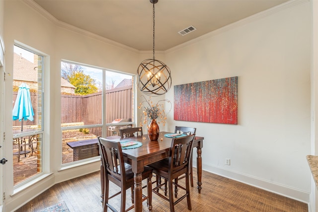 dining room featuring visible vents, an inviting chandelier, ornamental molding, wood finished floors, and baseboards