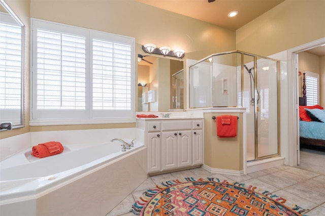 bathroom with tile patterned flooring, recessed lighting, vanity, a shower stall, and a bath