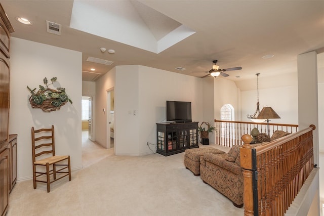 living room with light carpet, attic access, visible vents, a ceiling fan, and recessed lighting