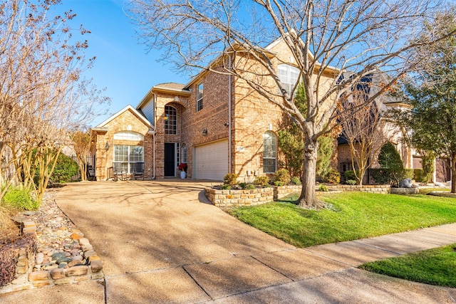 view of front of home with concrete driveway, brick siding, a front lawn, and an attached garage