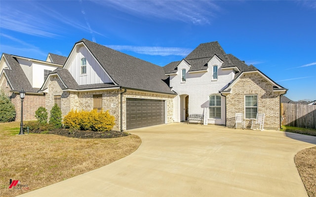 french country inspired facade with a garage and a front lawn