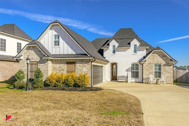 view of front of home with a garage and a front yard