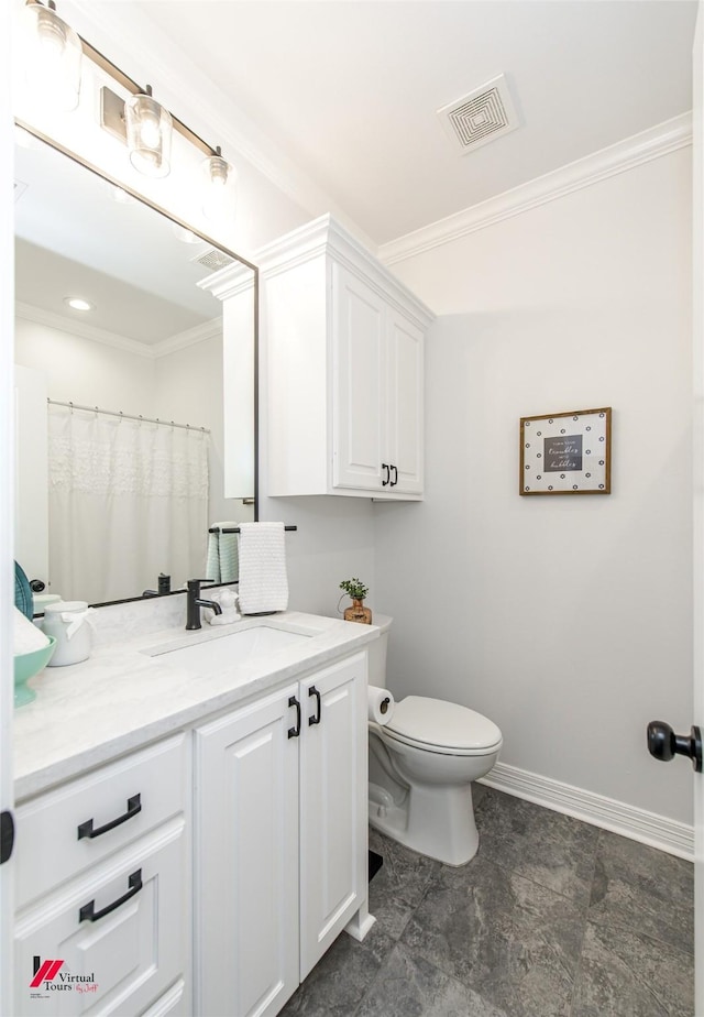 bathroom featuring vanity, toilet, and ornamental molding