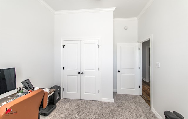 carpeted office space featuring ornamental molding