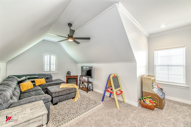 recreation room with ceiling fan, crown molding, light colored carpet, and vaulted ceiling