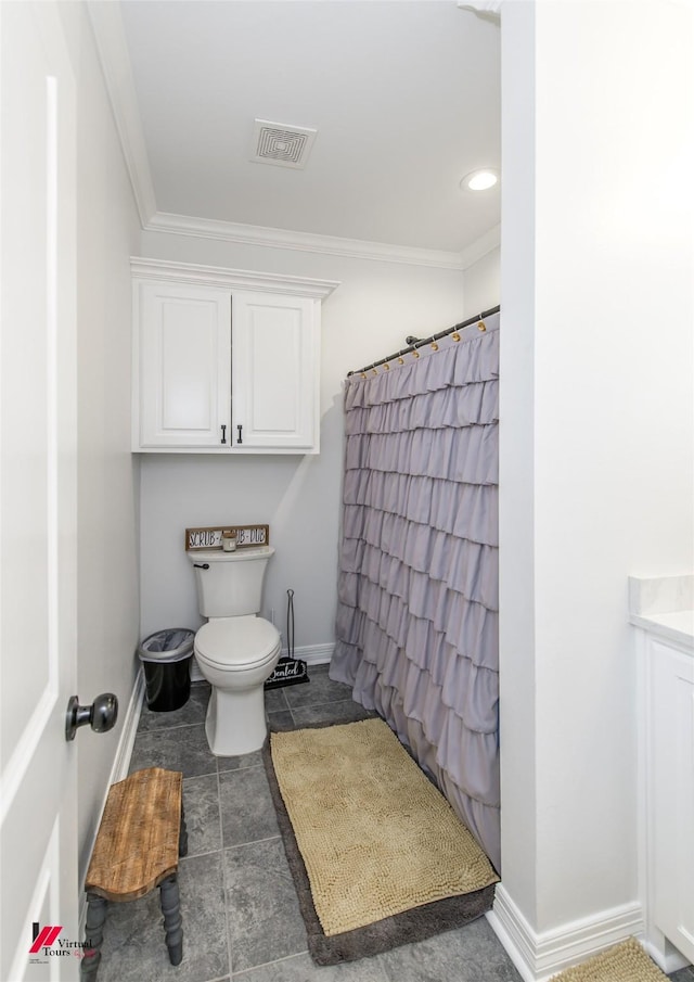 bathroom with toilet and crown molding