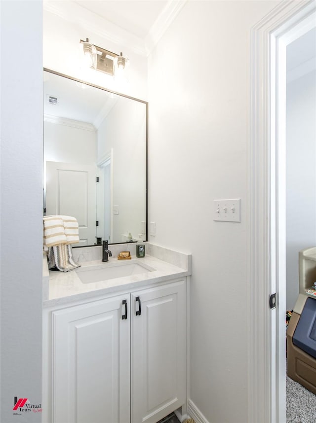 bathroom with vanity and crown molding