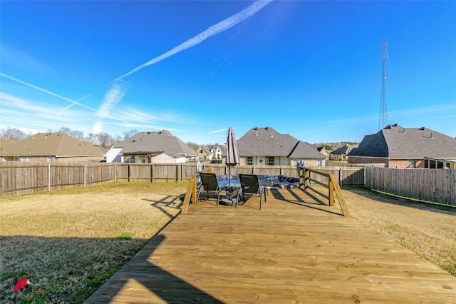 wooden deck with a lawn