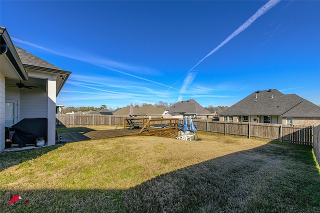 view of yard with a wooden deck