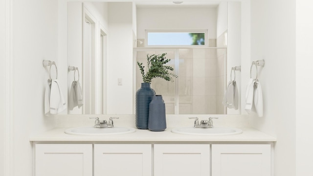 bathroom with vanity and a shower with door