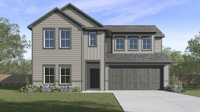 view of front of house featuring a garage and a front lawn