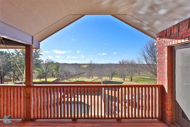 wooden deck featuring a rural view