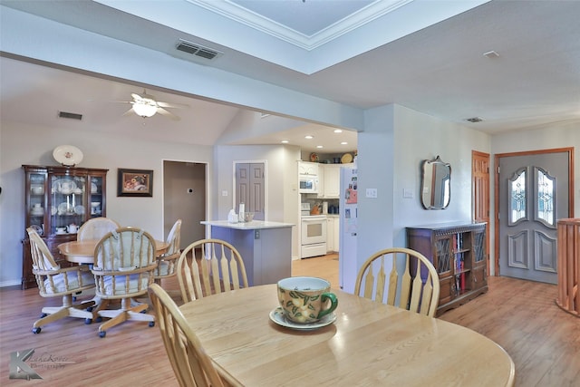 dining area featuring ornamental molding, light hardwood / wood-style flooring, ceiling fan, and lofted ceiling