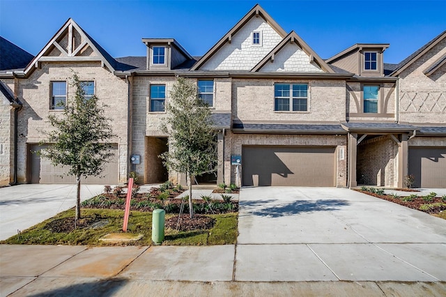 multi unit property featuring a garage