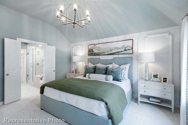 carpeted bedroom featuring an inviting chandelier, ensuite bath, and lofted ceiling