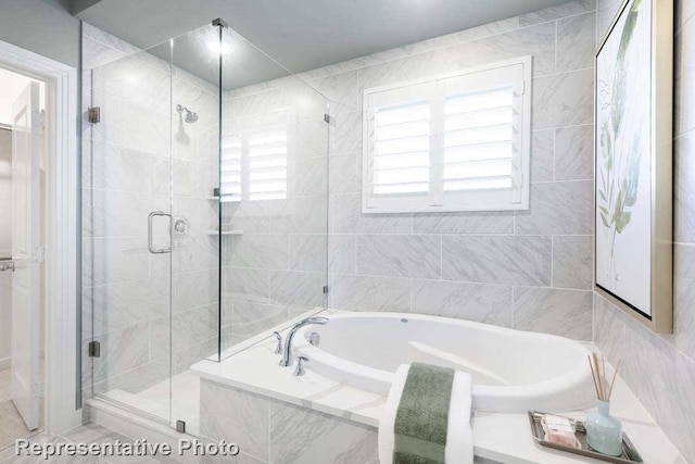 bathroom with separate shower and tub and tile patterned floors