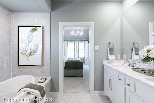 bathroom featuring a tub to relax in, a chandelier, tile patterned floors, and vanity