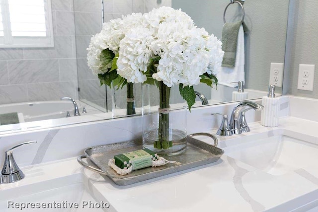 bathroom featuring a bathtub and vanity