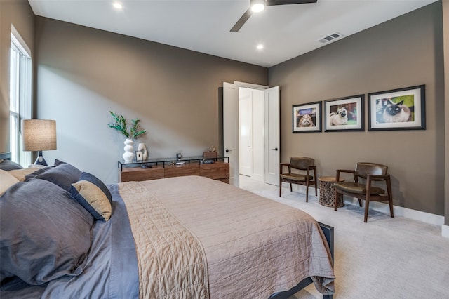 carpeted bedroom with ceiling fan