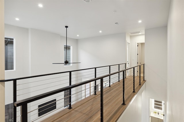 corridor featuring hardwood / wood-style floors