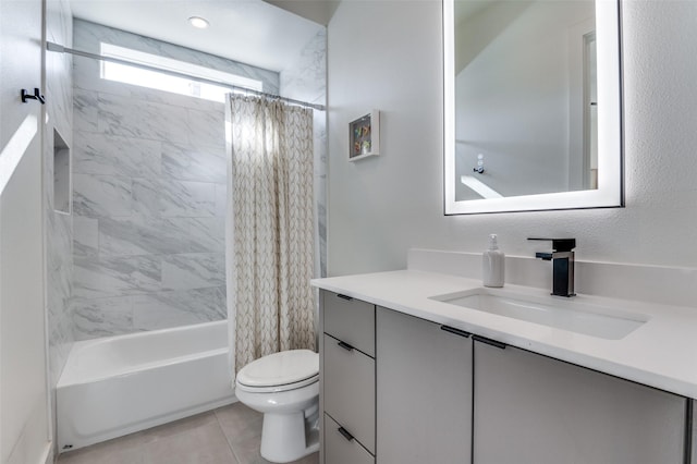 full bathroom featuring tile patterned floors, toilet, vanity, and shower / bath combination with curtain