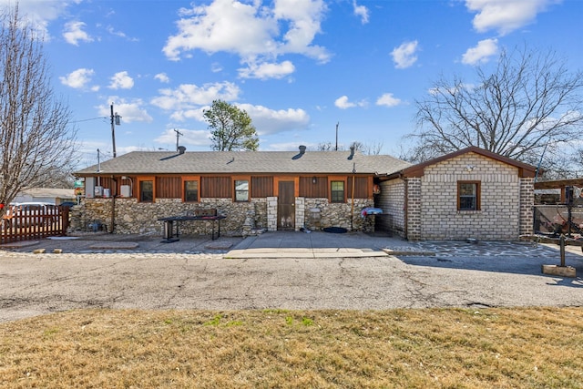 back of house featuring a lawn and a patio area