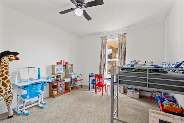 bedroom featuring ceiling fan and carpet