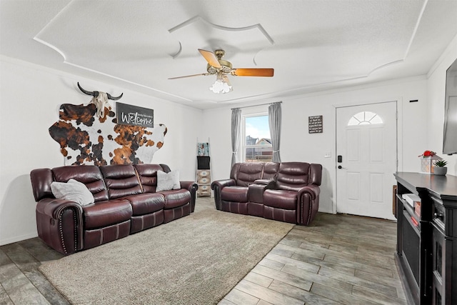 living room with hardwood / wood-style flooring and ceiling fan