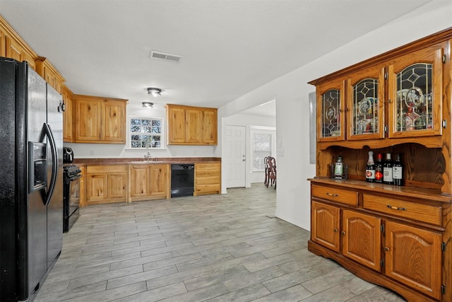 kitchen with black appliances and sink