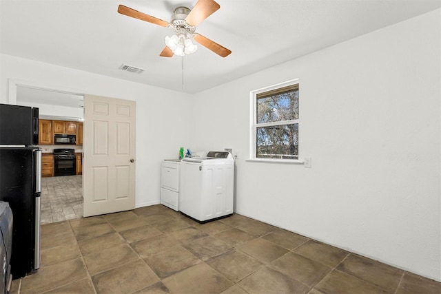 washroom featuring washer and dryer and ceiling fan