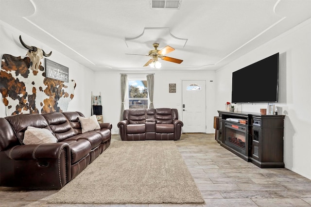 living room with ceiling fan and light hardwood / wood-style floors