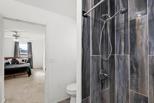 bathroom with a shower, toilet, and ceiling fan