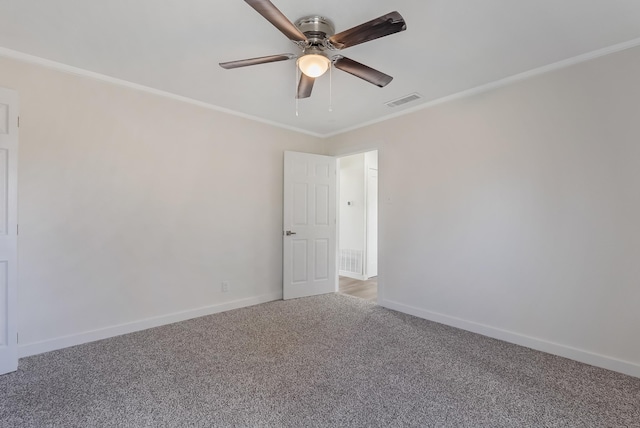 spare room with ceiling fan, carpet floors, and ornamental molding