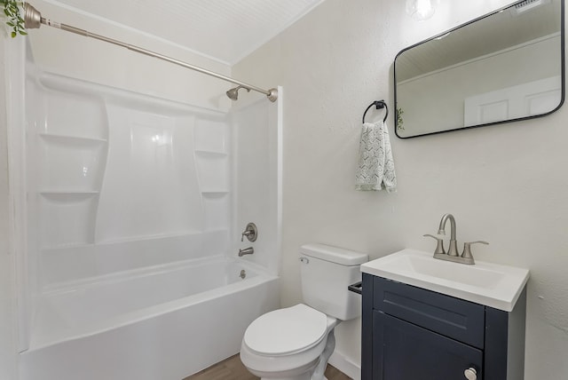 full bathroom featuring hardwood / wood-style floors, vanity, toilet, and bathtub / shower combination