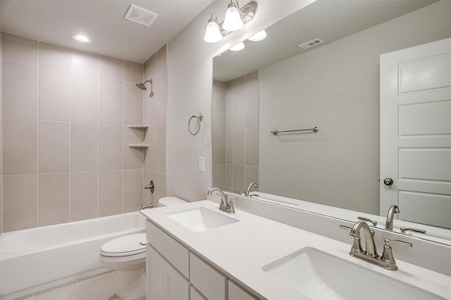 full bathroom with tile patterned floors, vanity, toilet, and tiled shower / bath combo