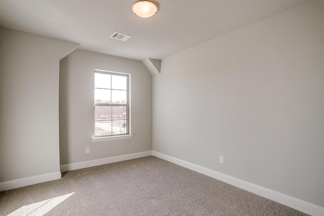 additional living space featuring carpet floors