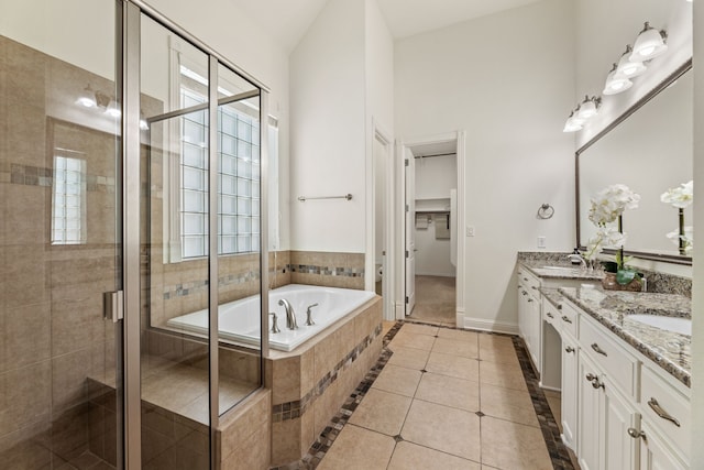 bathroom featuring vanity, tile patterned floors, and independent shower and bath