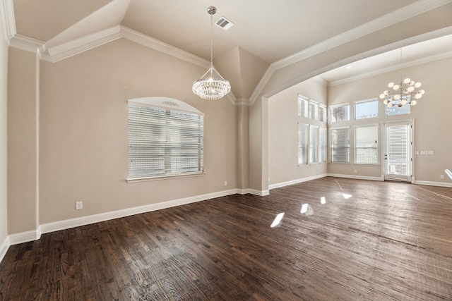 unfurnished dining area with lofted ceiling, crown molding, and a chandelier