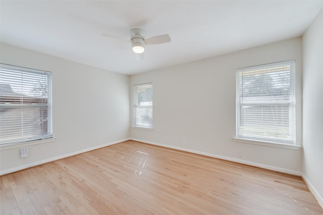 unfurnished room with ceiling fan and light hardwood / wood-style floors