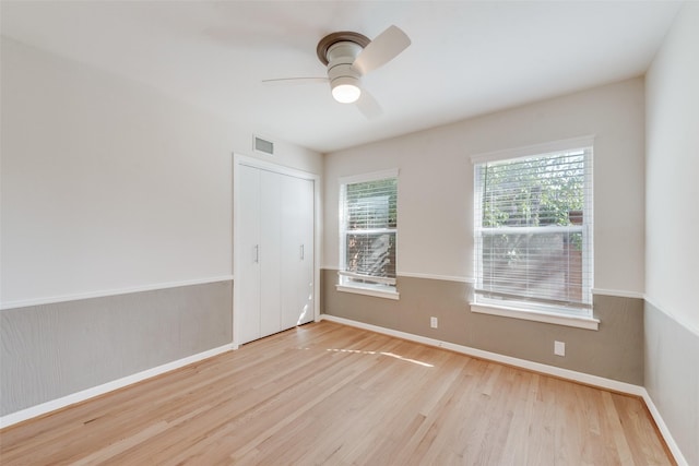 empty room featuring light hardwood / wood-style flooring and ceiling fan