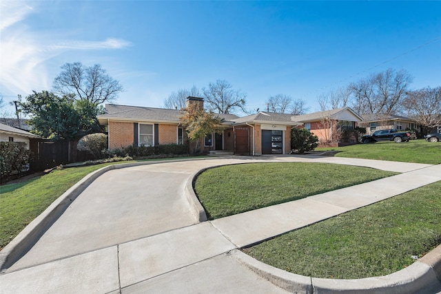 ranch-style house featuring a garage and a front yard