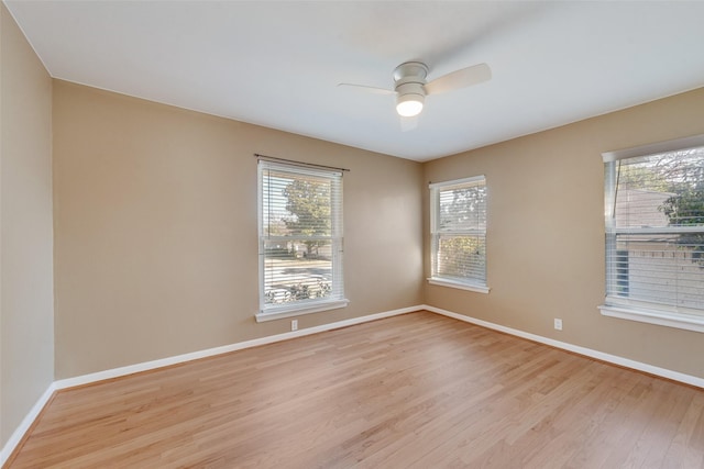 spare room featuring light hardwood / wood-style floors and ceiling fan