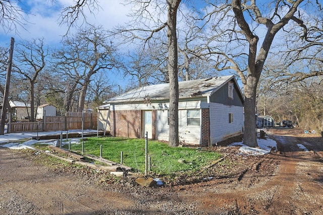 view of outbuilding with a yard